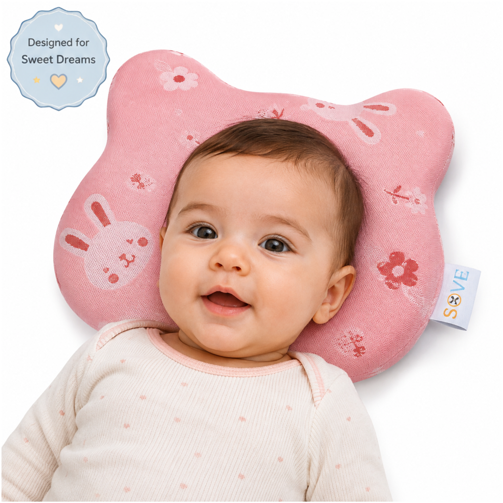 Baby smiling on Sove Pink Bunny and Floral memory foam head shaping pillow