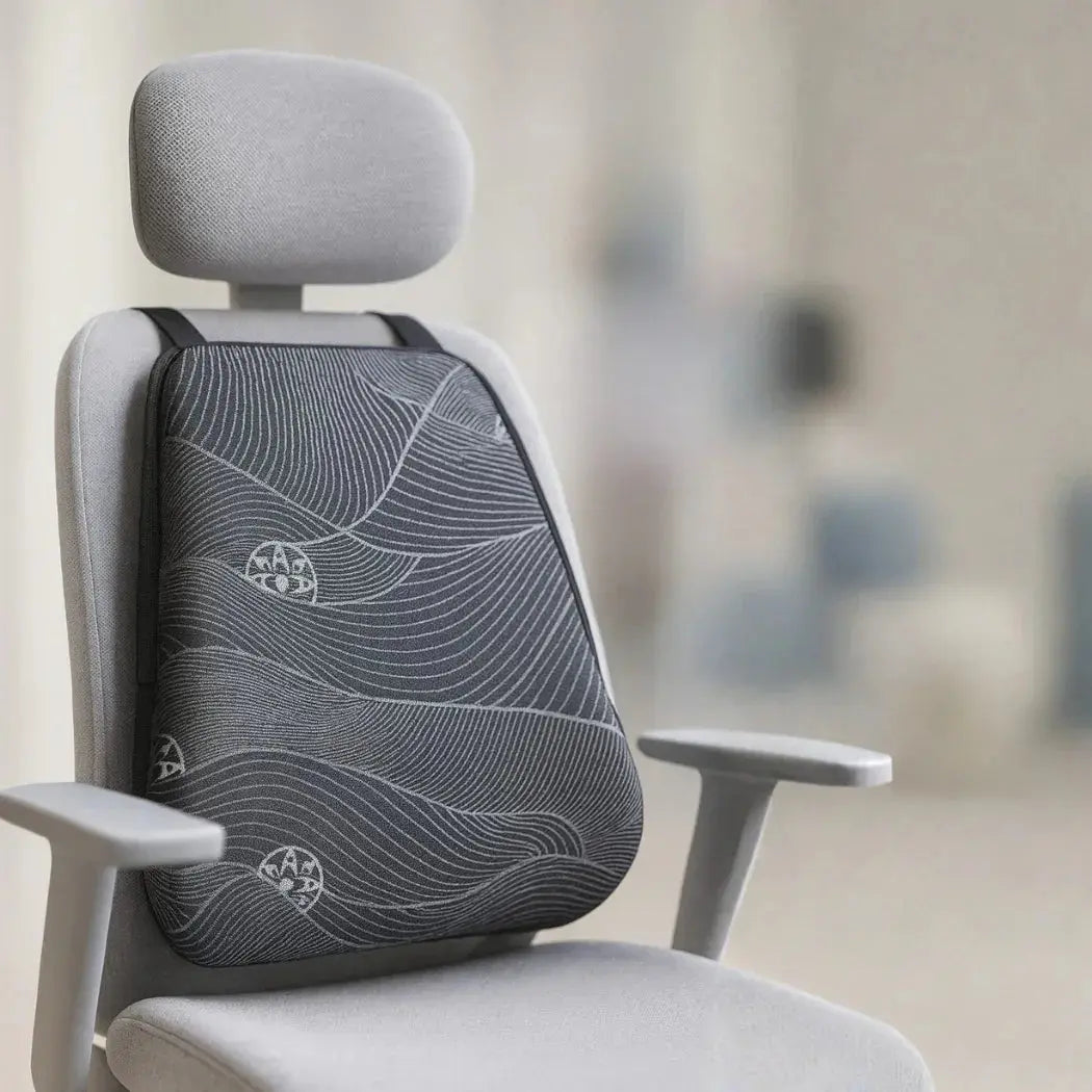 Slim ergonomic back cushion with memory foam on an office chair for posture support