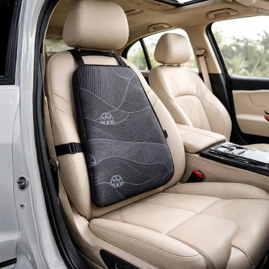 Ergonomic black back support cushion on beige car seat for posture and lumbar comfort